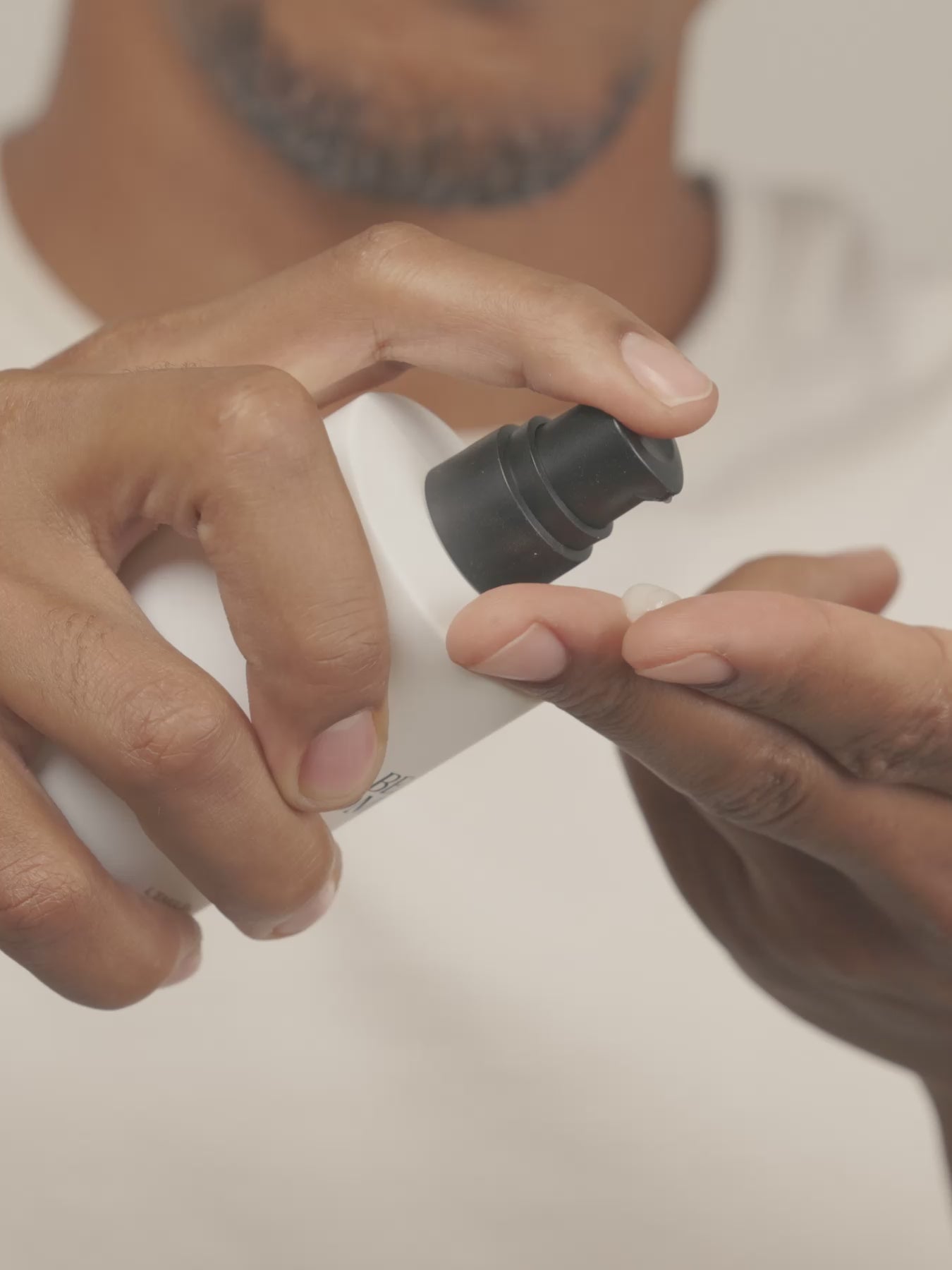 Video of a man applying The Cleansing Emulsion, a women applying The  Fluid Cream and a man applying The Fluid Cream as well